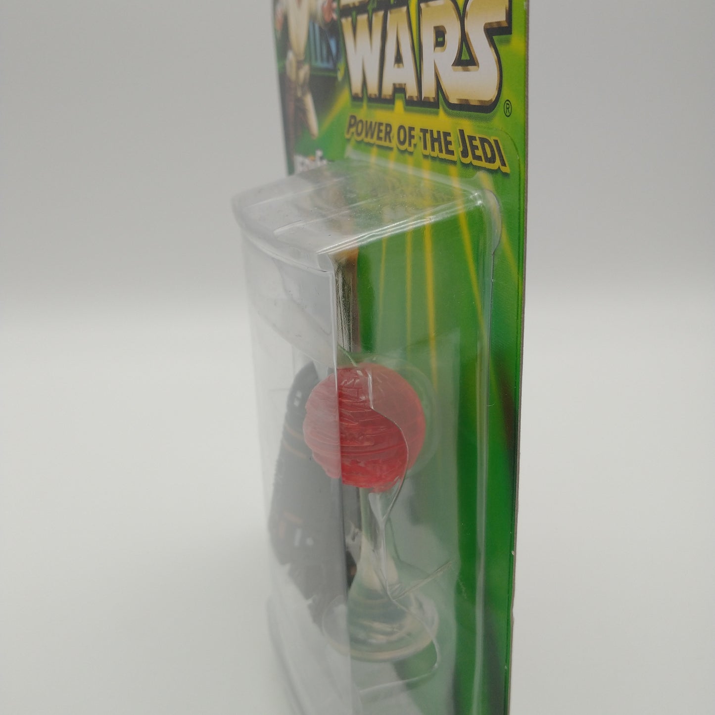 A picture of the left side of the cart and bubble. The action figure is inside.