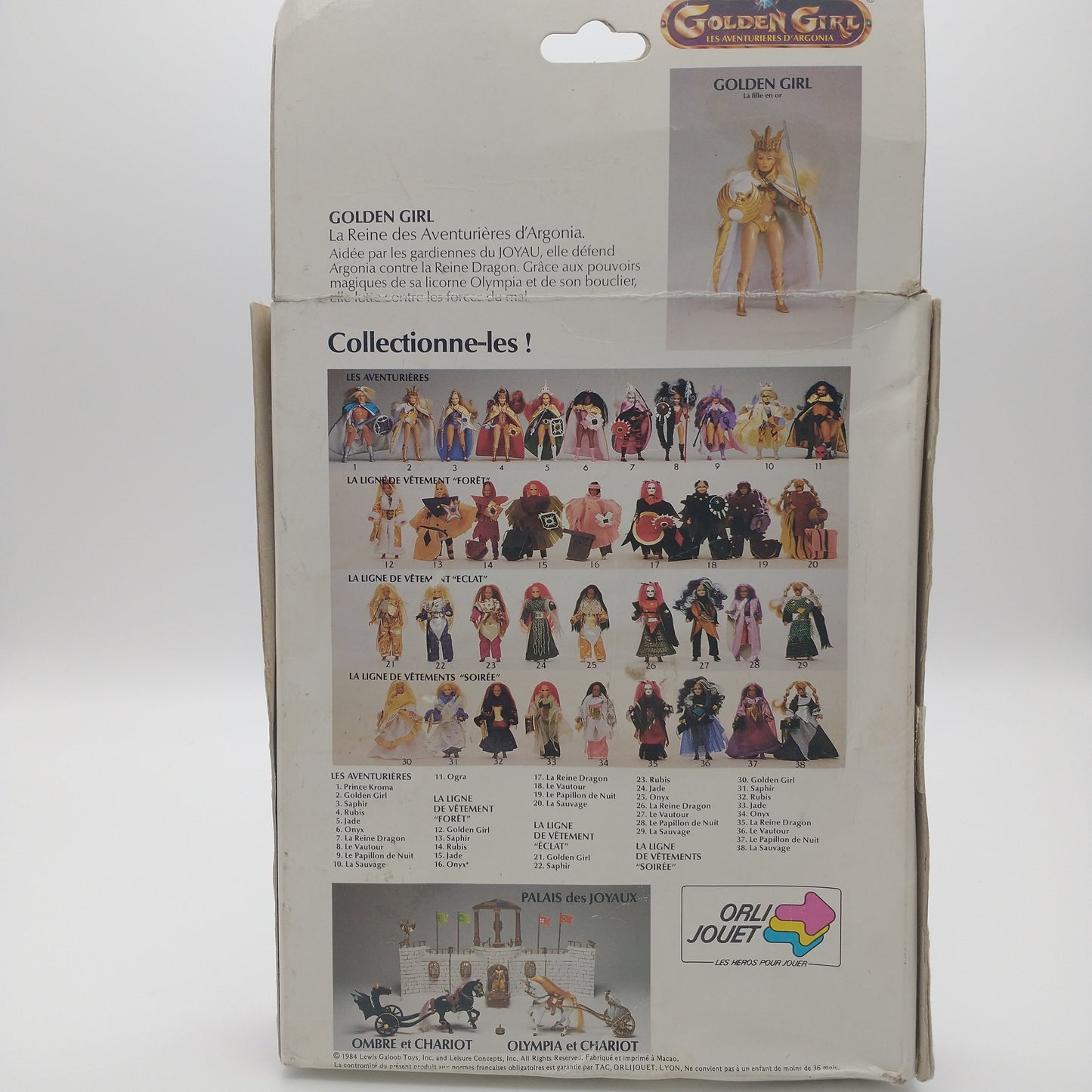 A picture of the back of the card featuring pictures of other action figures available along with various playsets available for purchase.