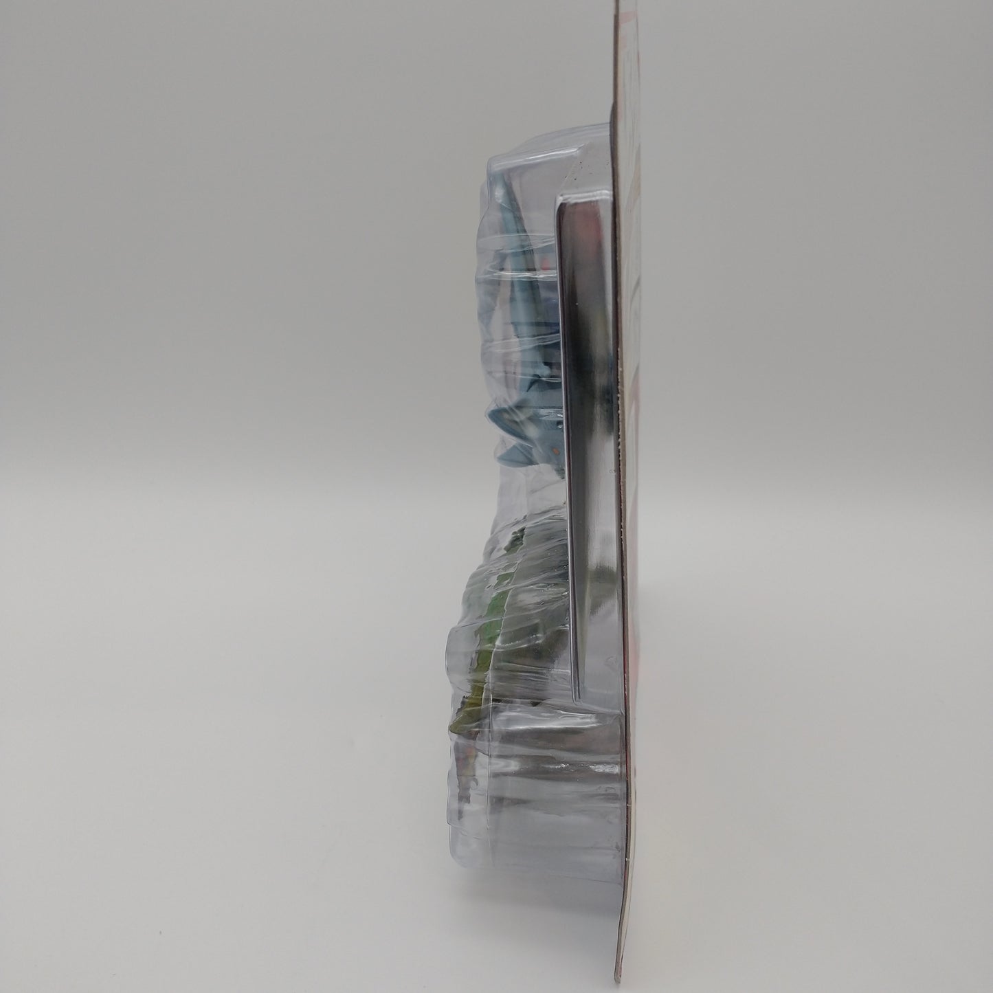 A picture of the left side of the card and bubble. The action figure is inside.