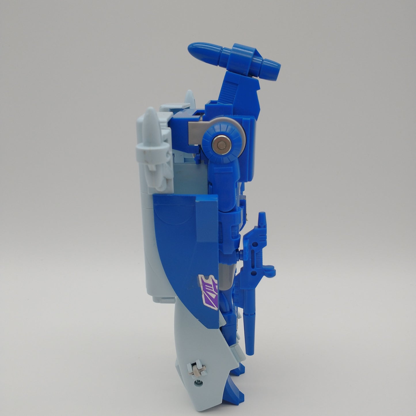 The action figure from the left side