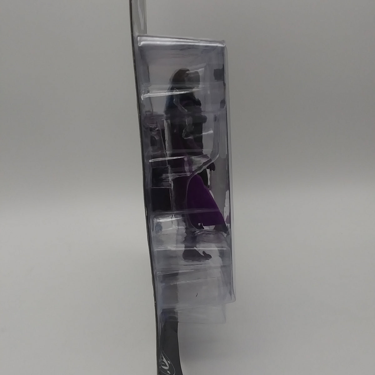 A picture of the left side of the cart and bubble. The action figure is inside.