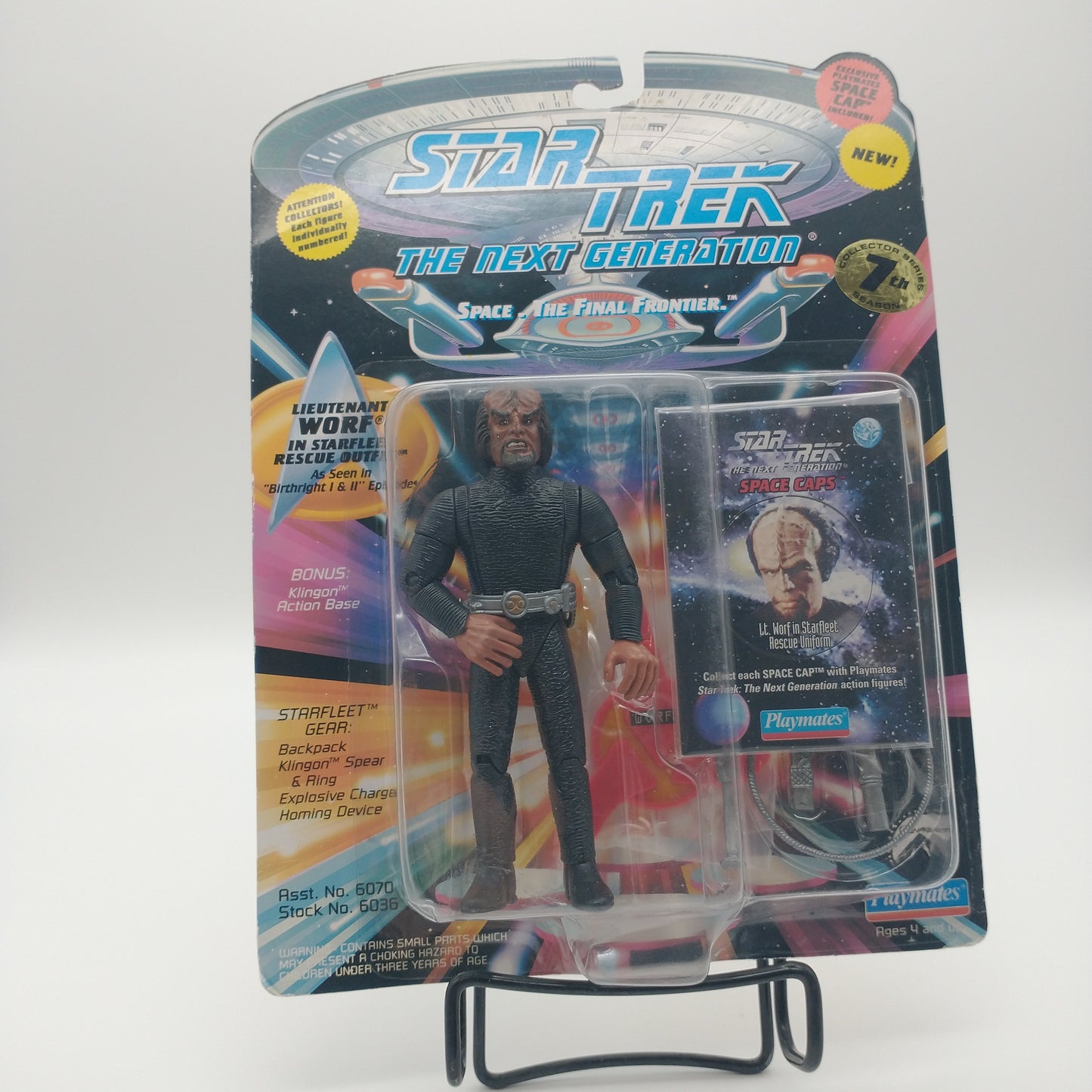 The front of the box and bubble. The bubble is sealed, the action figure inside has dark skin and is wearing a black jumpsuit with a silver belt. Next to him is a collectible card featuring a picture of the character worf