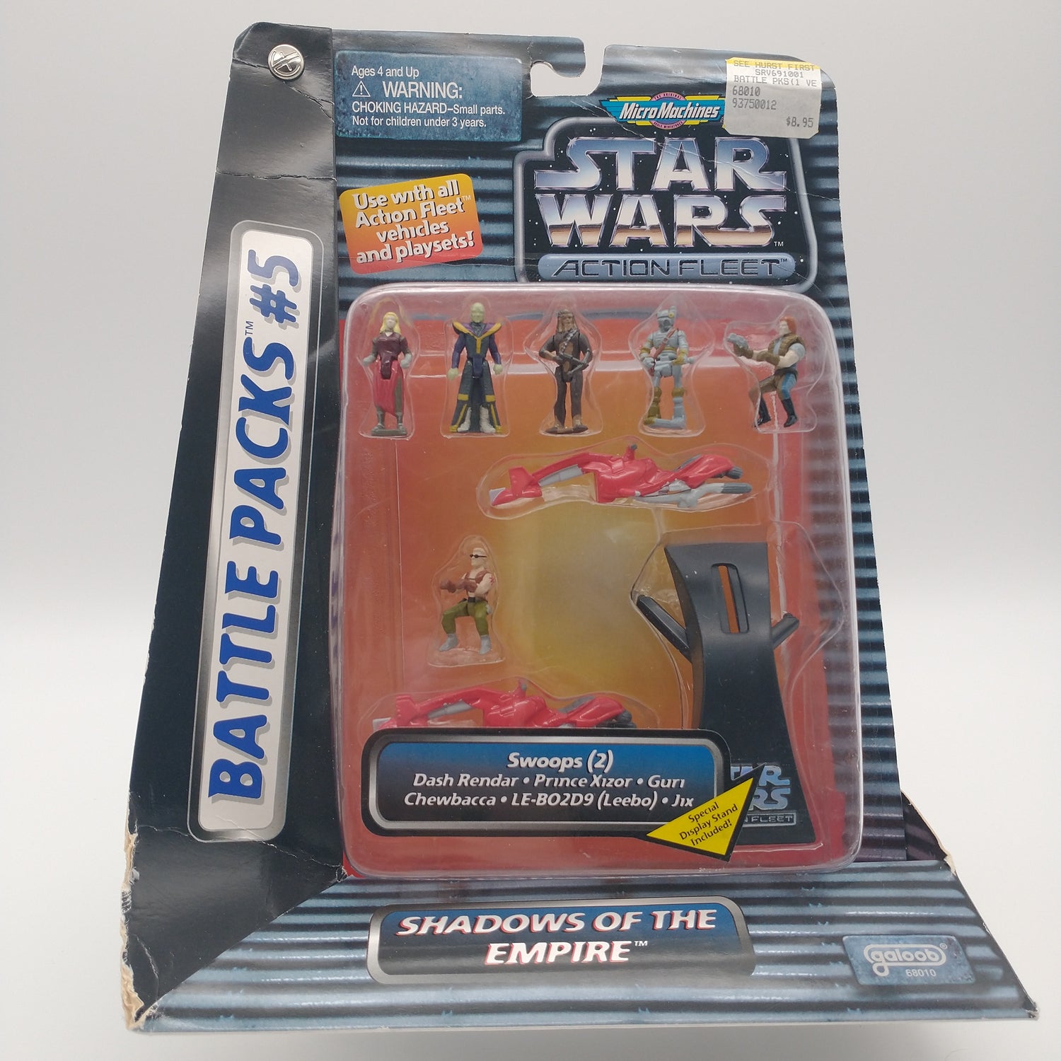The front of the box and bubble. The bubble is sealed, the action figures inside are 