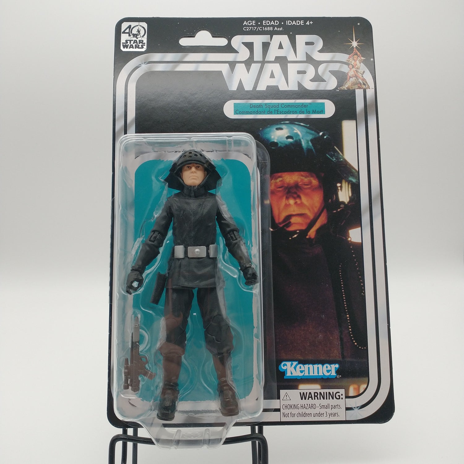 The front of the cart and bubble are sealed and undamaged. The action figure inside is wearing black clothing with a silver belt and a black mushroom shaped hat.