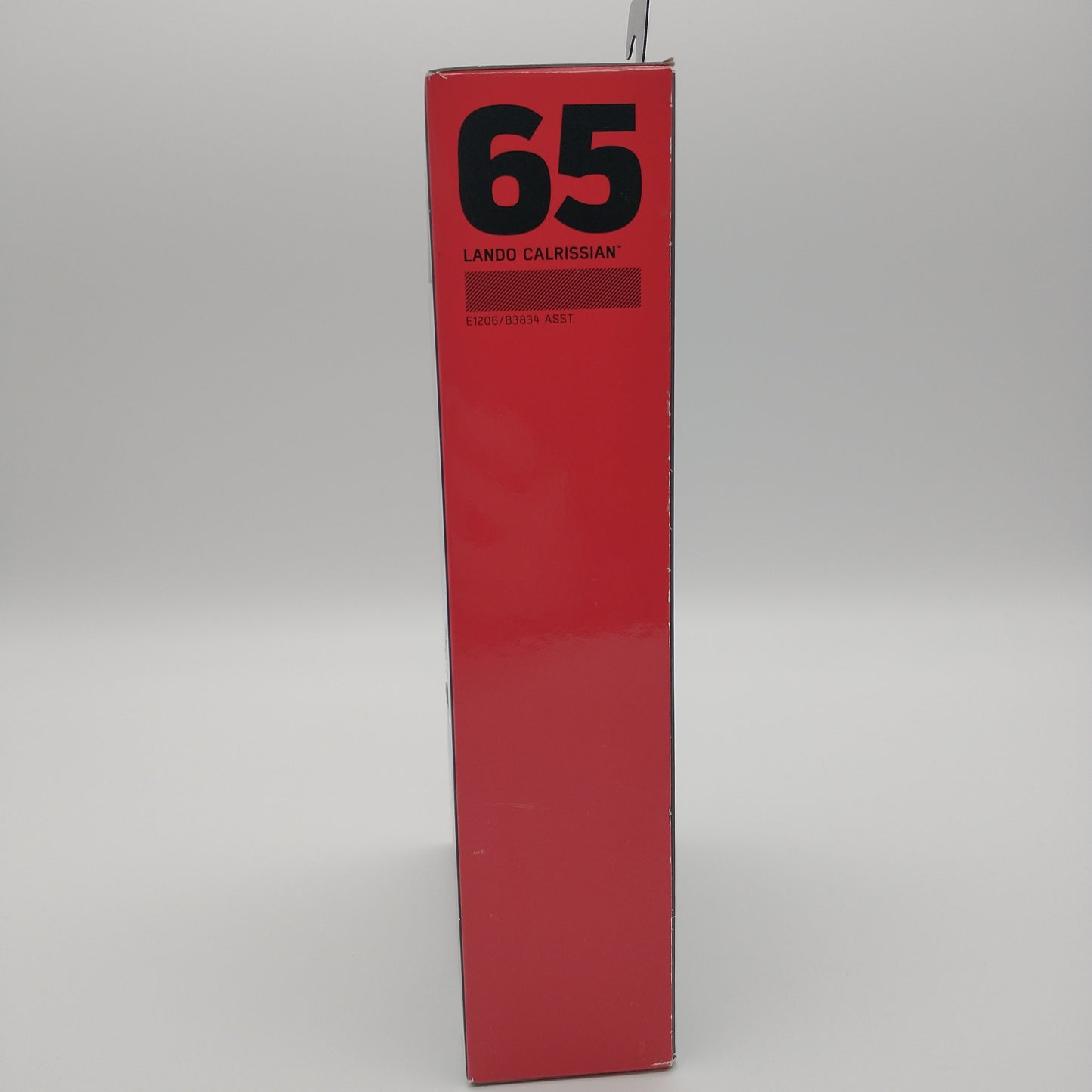 The side of the box is red with the number 65 printed on the top in bold black lettering.