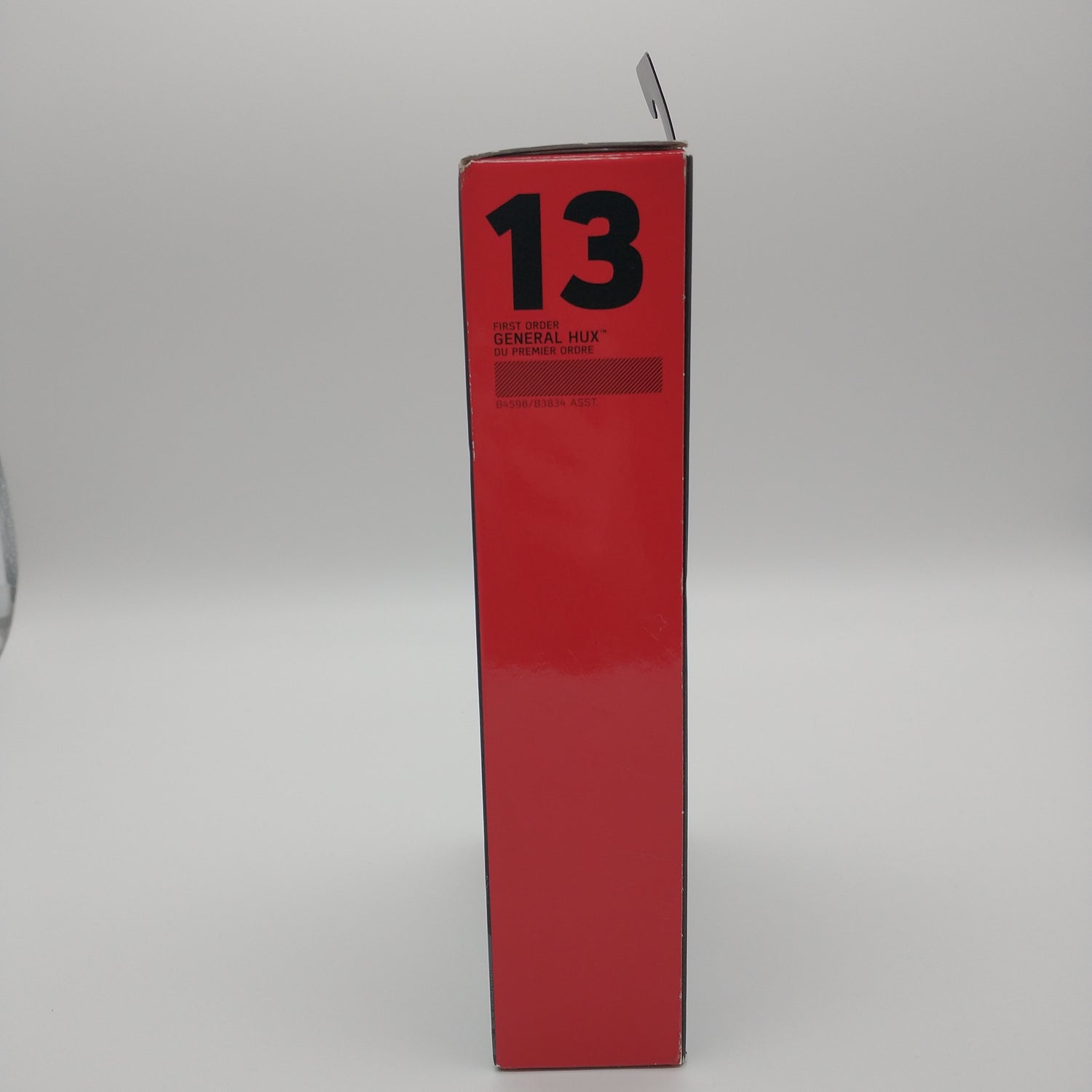 The side of the box is red with the number 13 written on the top in black lettering.