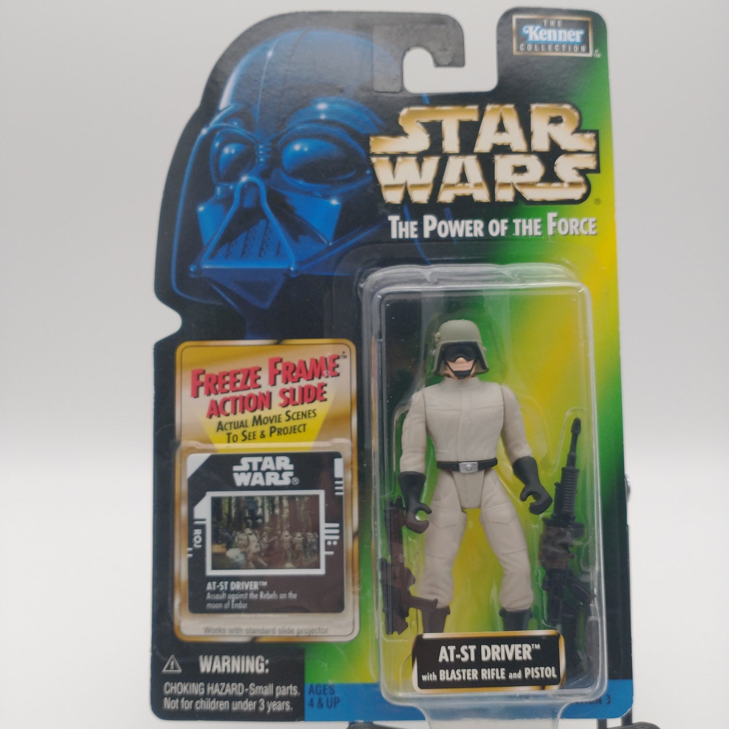 The front of the card and bubble. The action figure inside is wearing a white uniform and a dark grey helmet with sunglasses