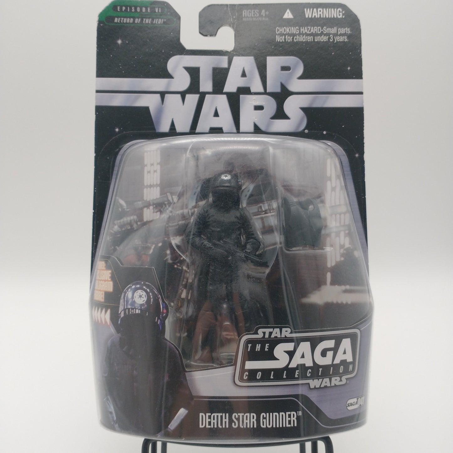 The front ofhte card and bubble. The action figure inside is wearing a black helmet and a black uniform