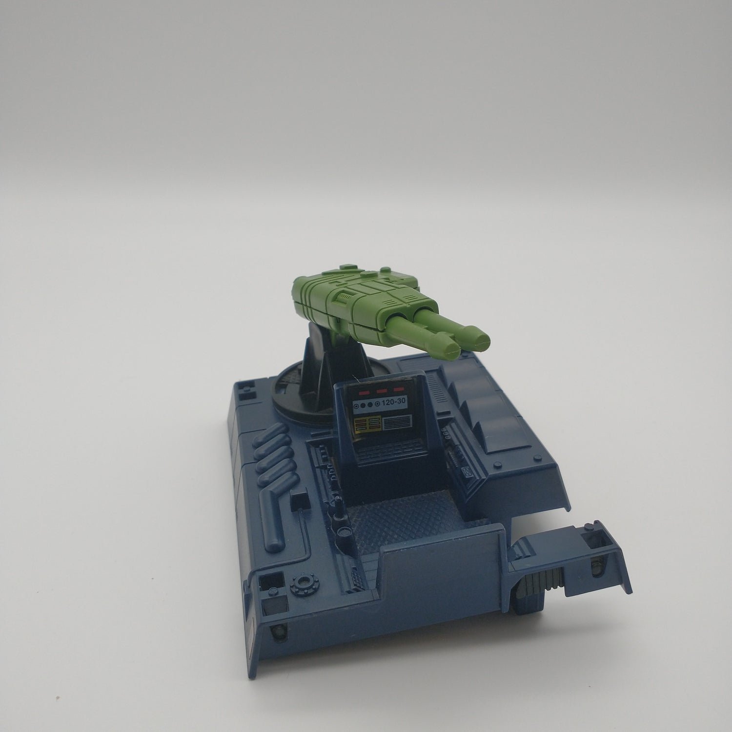 The blue top of the vehicle with the green missile launcher