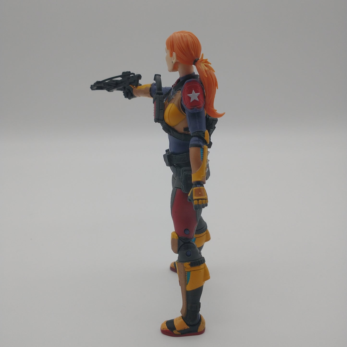 The action figure from the left side