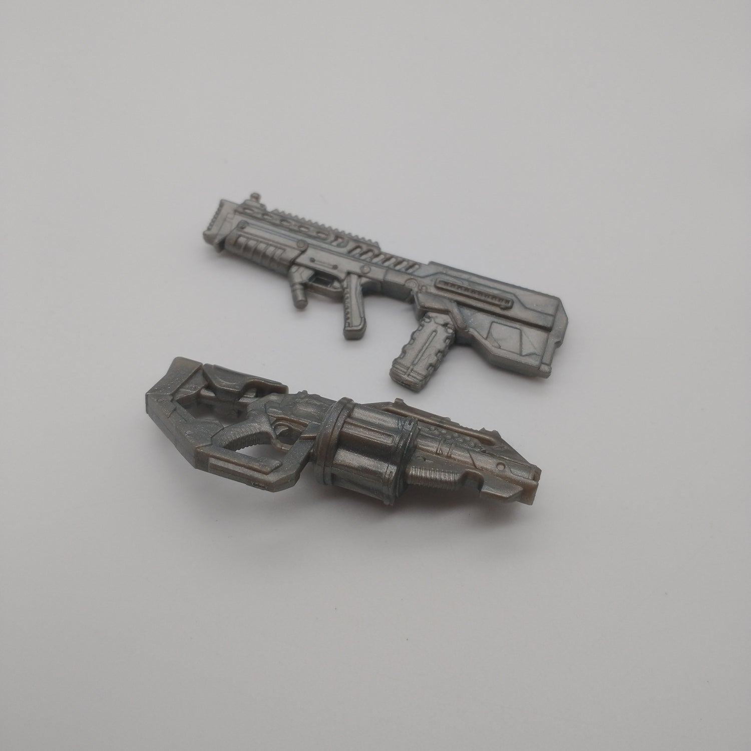 A close up of two silver guns