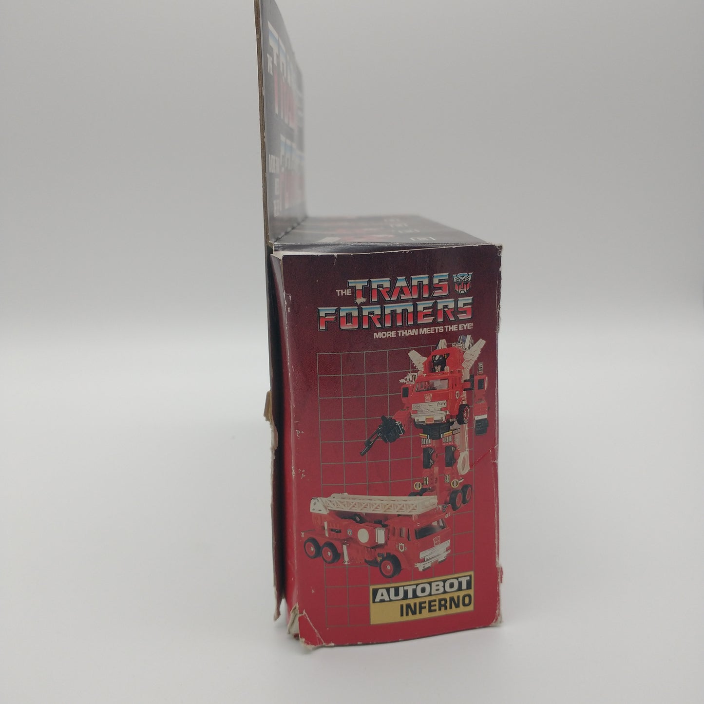 The right side of the box is red with a picture of the figure
