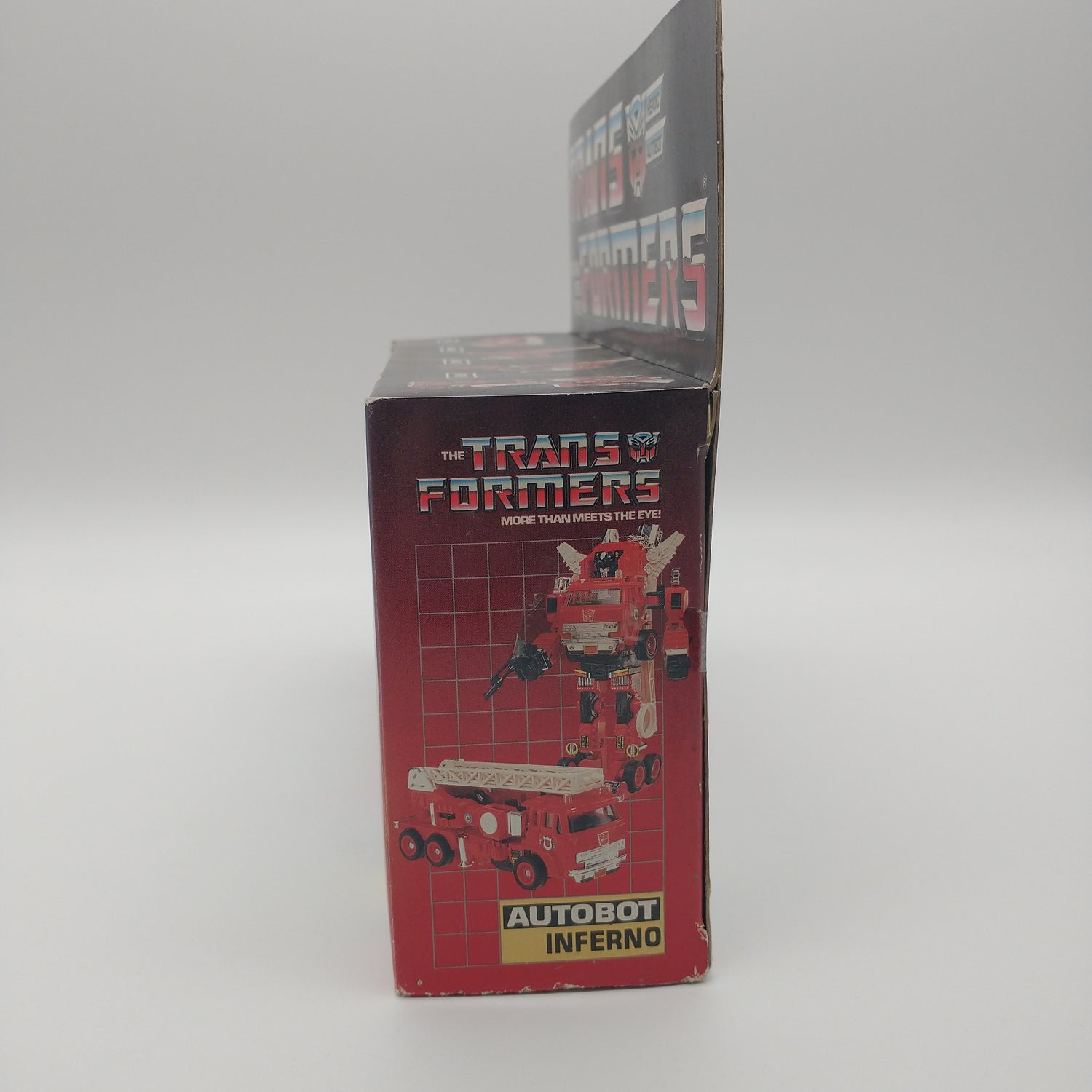 The left side of the box is red with a picture of the figure