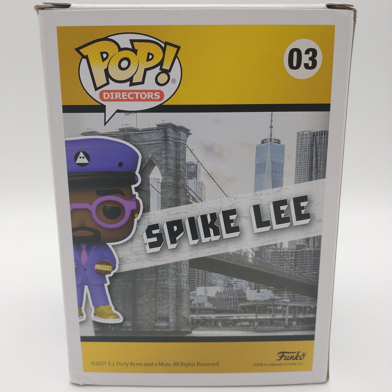The back of the card featuring images of the action figure and a summary of information about them. It is illegible in the picture.