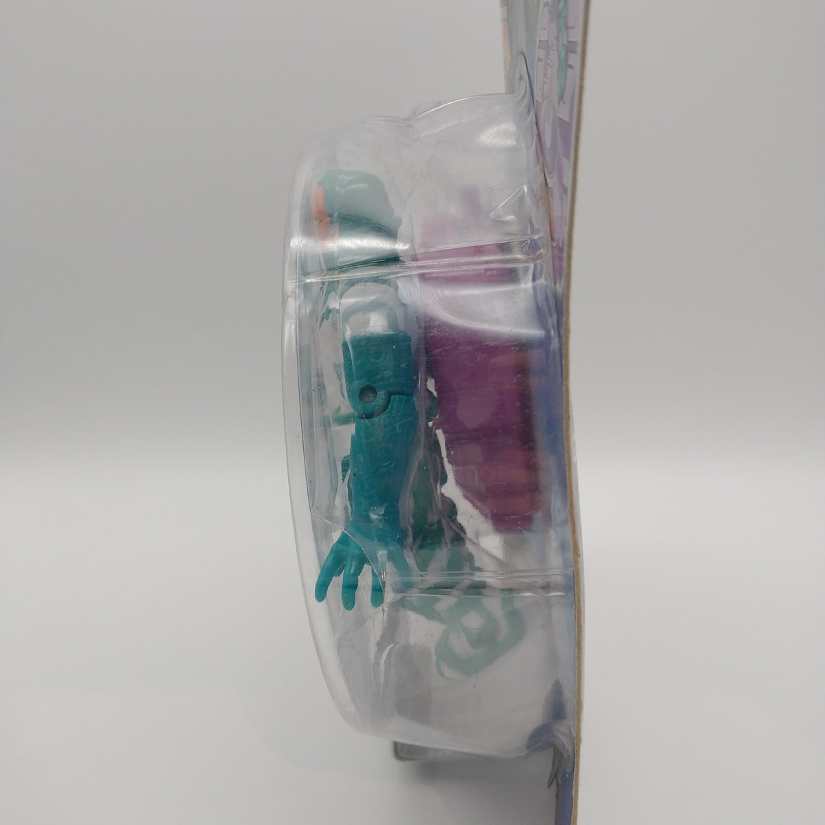 A picture of the left side of the card and bubble. The action figure is inside.