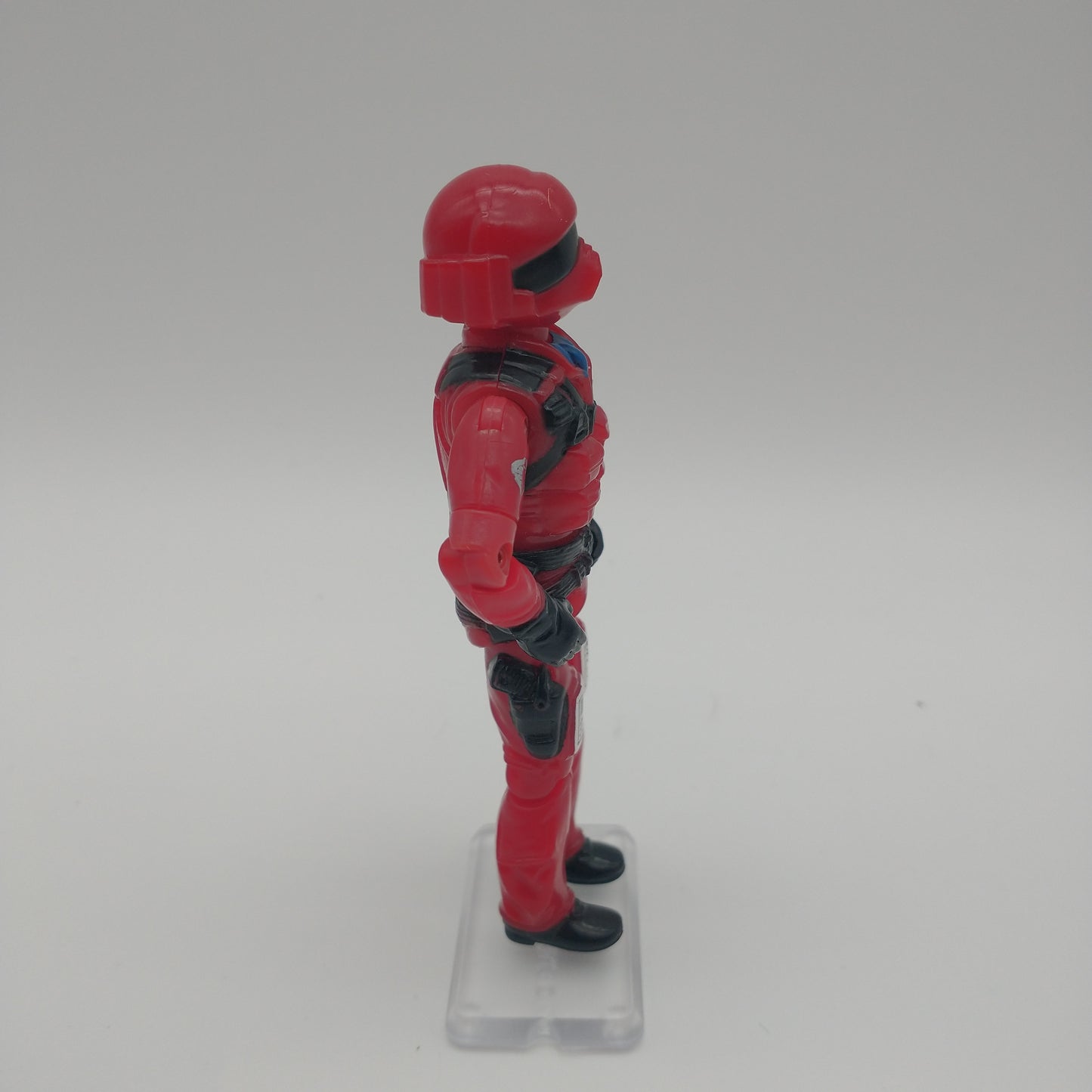 The action figure from the left side
