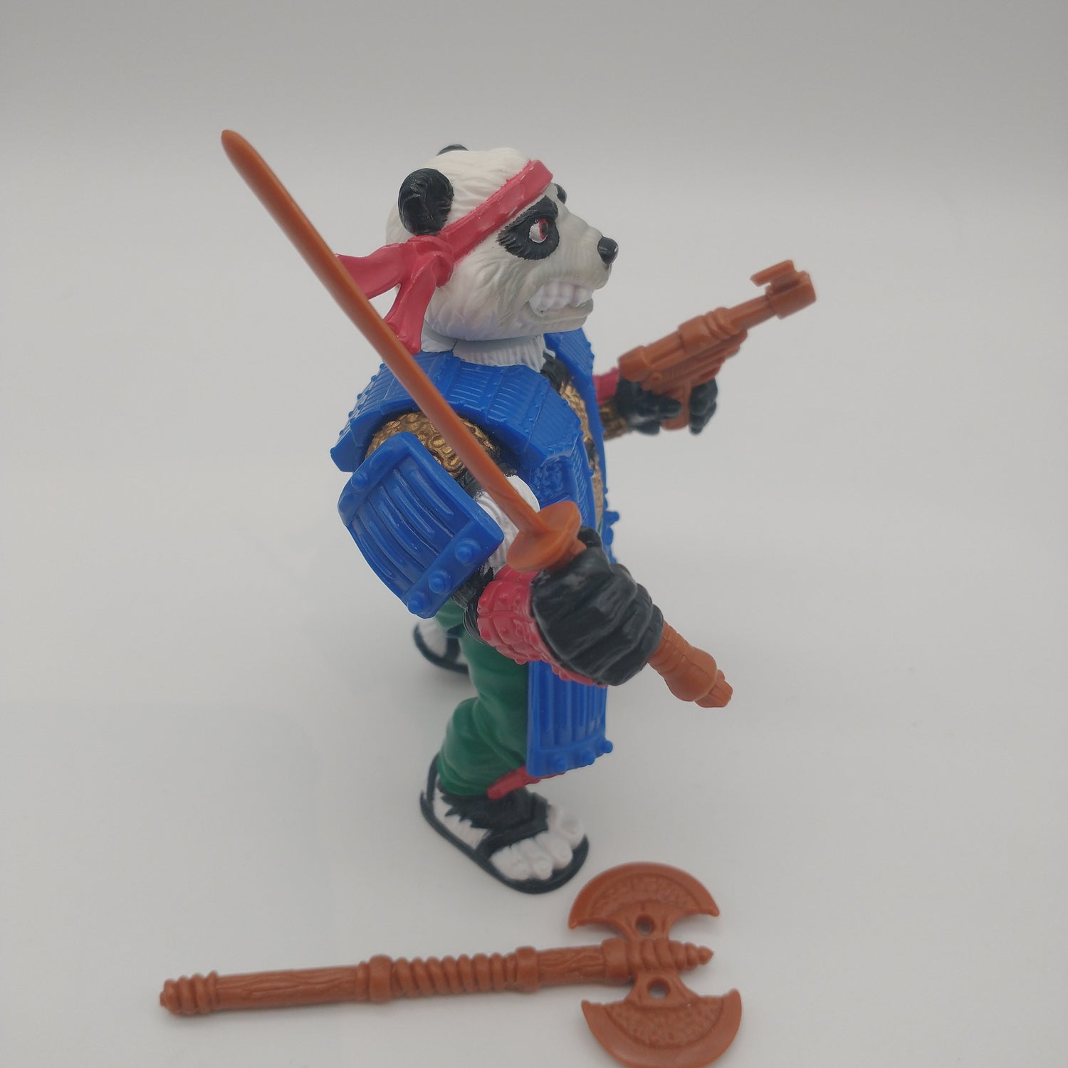 The action figure from the left side