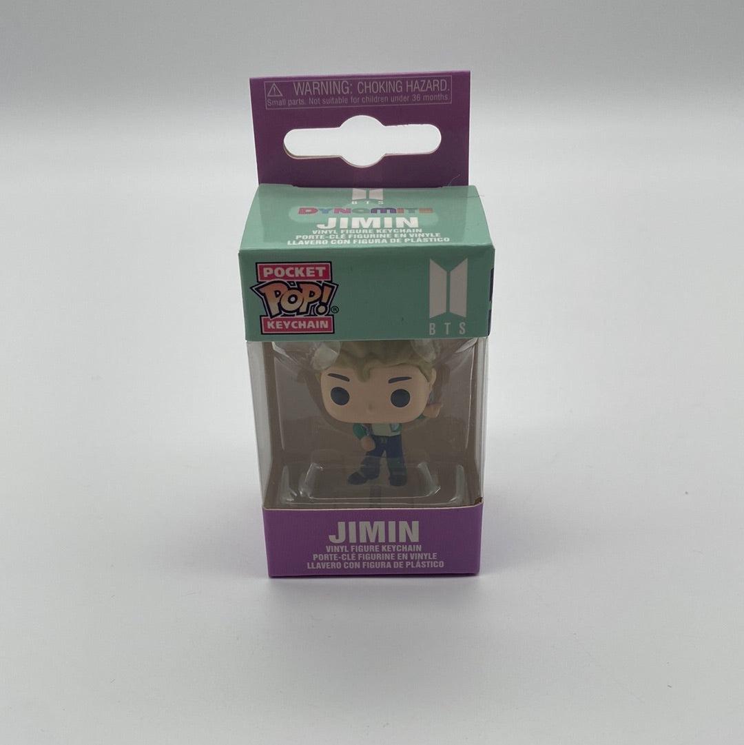 The front of the box and bubble. The bubble is sealed, the action figure inside has blonde hair and is wearing black pants and a light blue shirt
