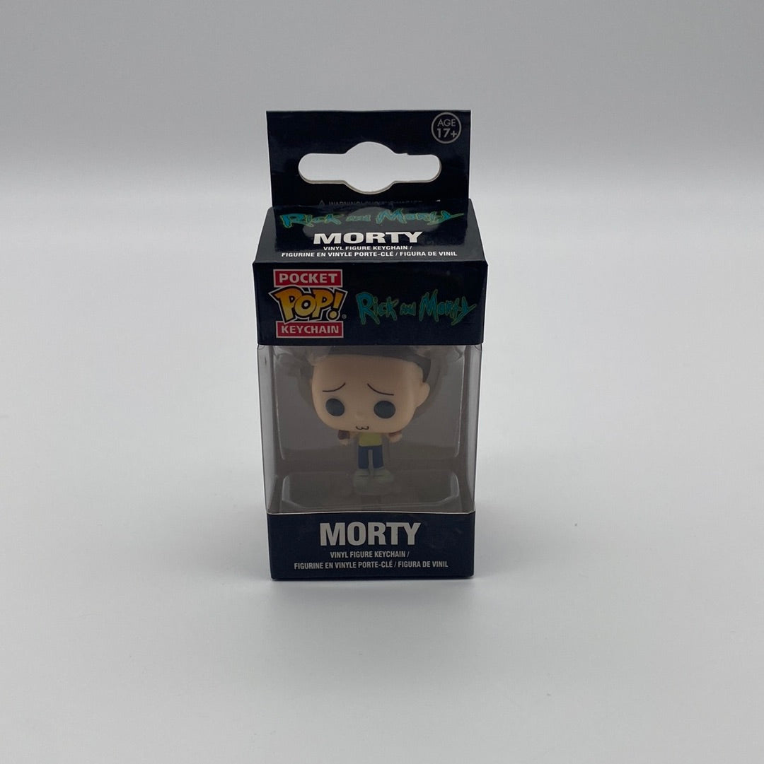 The front of the box and bubble. The bubble is sealed, the action figure inside is light skinned with a large forehead and brown hair