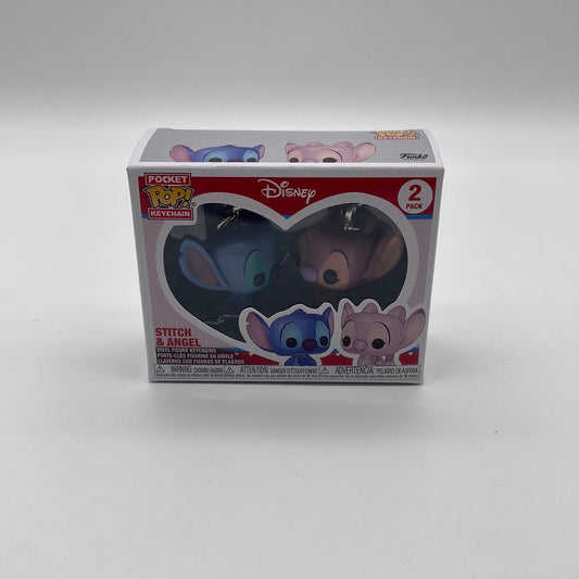 The front of the box and bubble. The bubble is sealed, the action figures inside are two little aliens, one blue, one pink. They're facing towards each other.