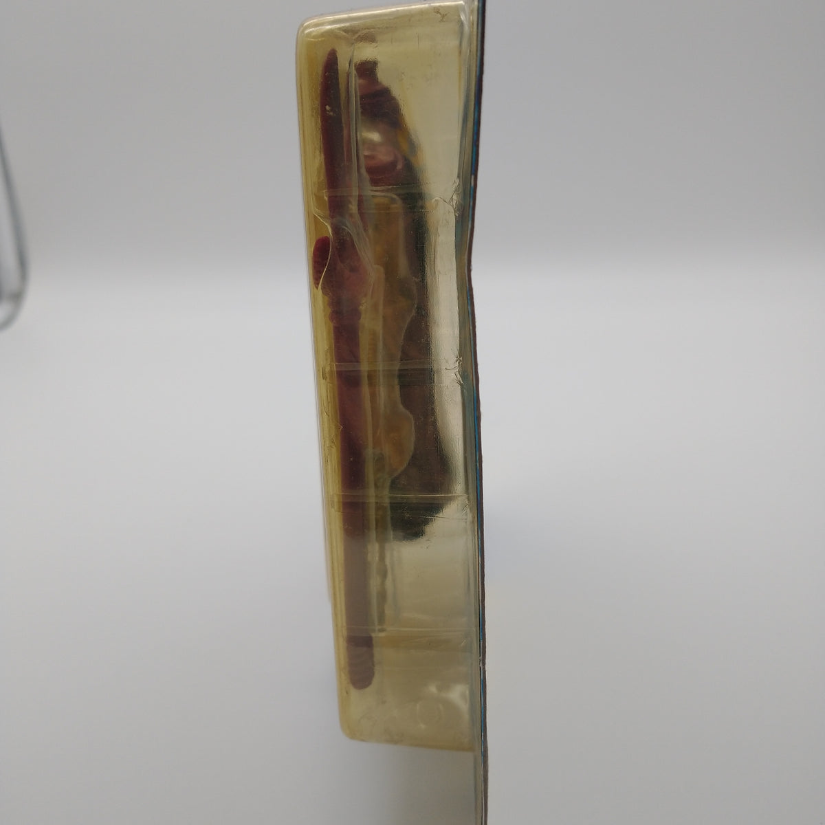 A picture of the bubble from the side with a side view of a red spear.